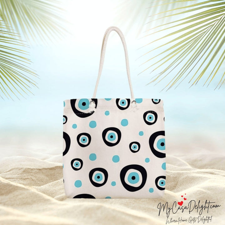 Summer-ready canvas tote inspired by Evil Eye. Sustainable style for your adventures. Spacious, durable, chic. Free Fedex